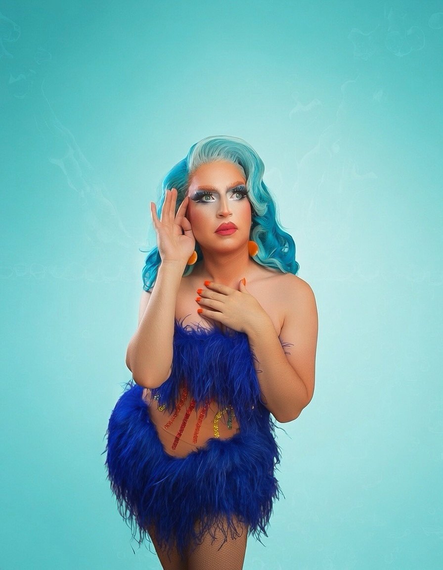 Irene Bru portrait in a blue feather look